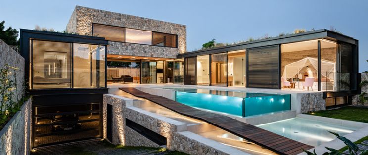 Casa H60: simbiosis y juego de materiales